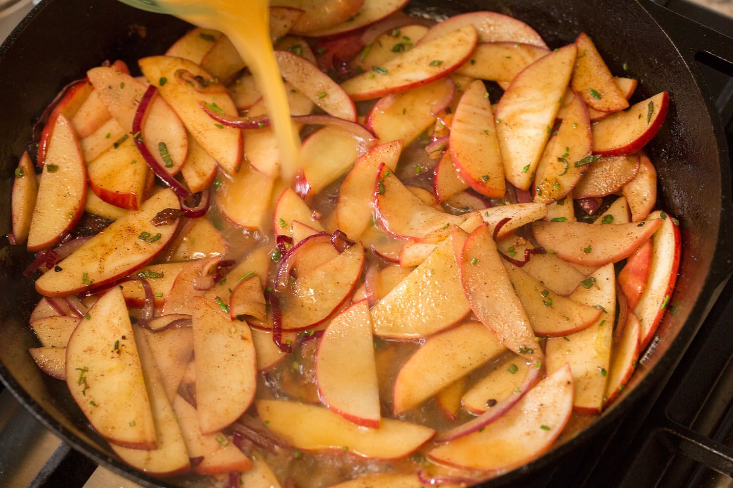 Apple Chicken Apples shown after sautéing in butter with apple juice being added to create a pan sauce.