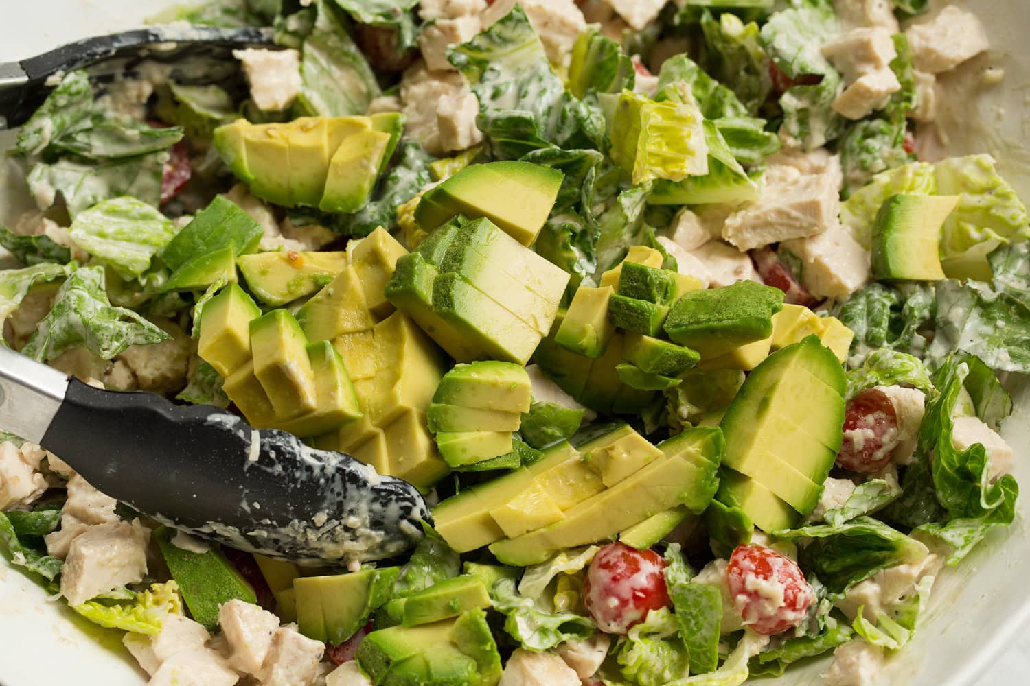 Chicken Caesar Wrap Diced avocado added to salad.