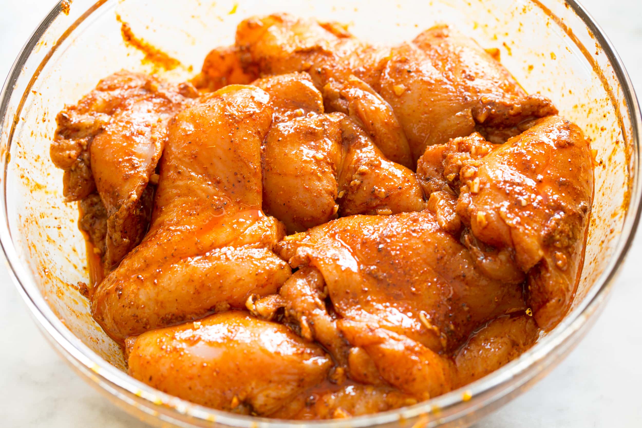 Chicken Taco Salad Chicken soaking in Mexican spice marinade.