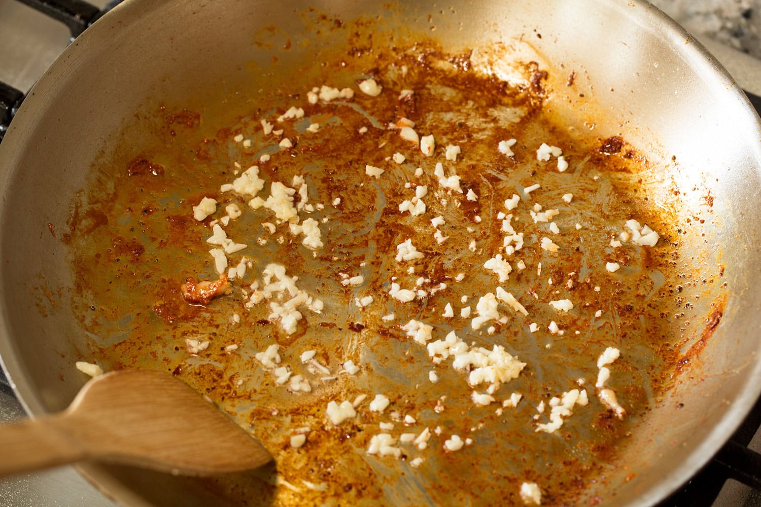 Creamy Dijon Mustard Chicken Garlic sauteed in skillet.