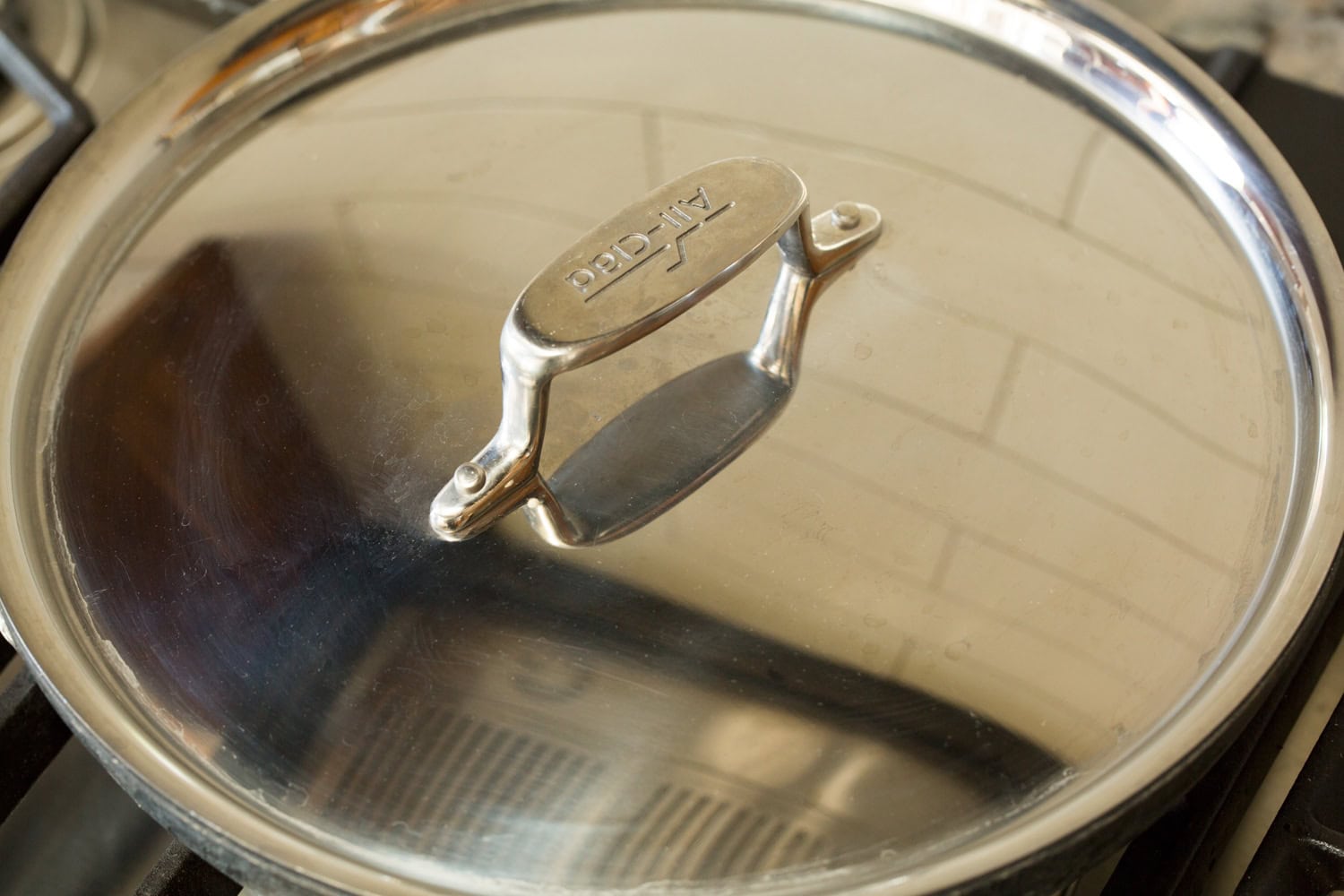 Egg White Omelette Lid over skillet to cook egg white omelette.