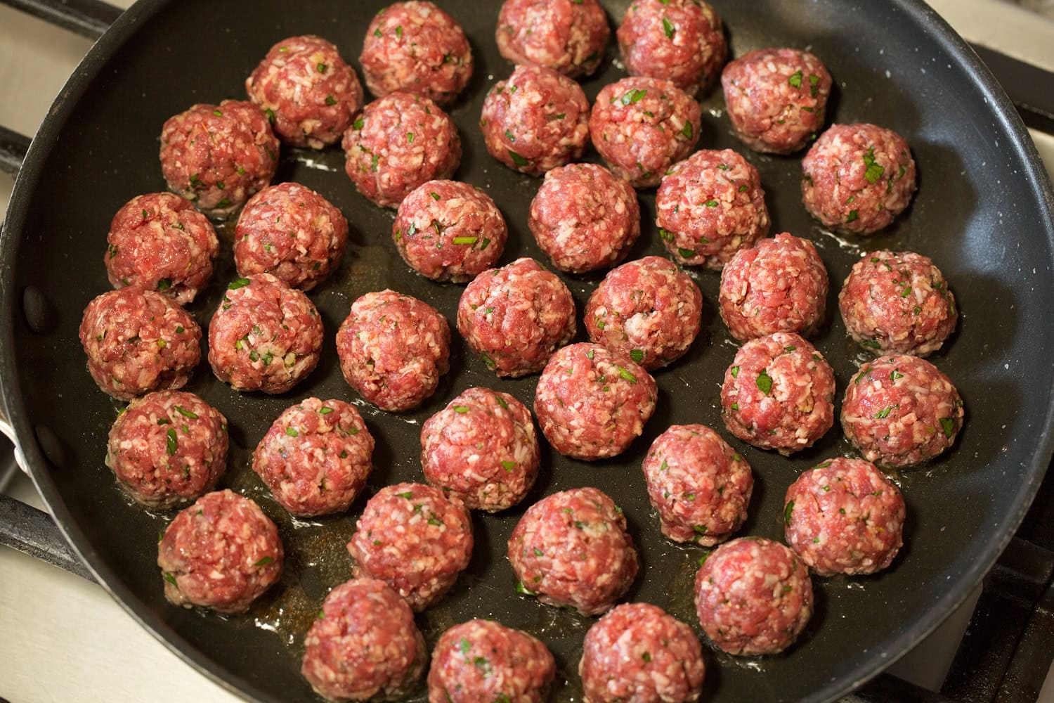 Meatball Soup Meatballs in skillet before browned.