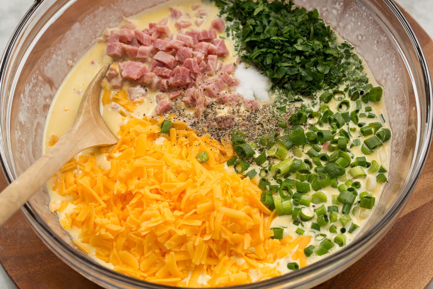 Mini Quiche Quiche fillings added to egg mixture.