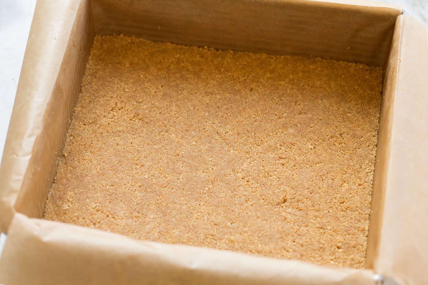 No Bake Cheesecake Graham cracker crust pressed into baking dish.