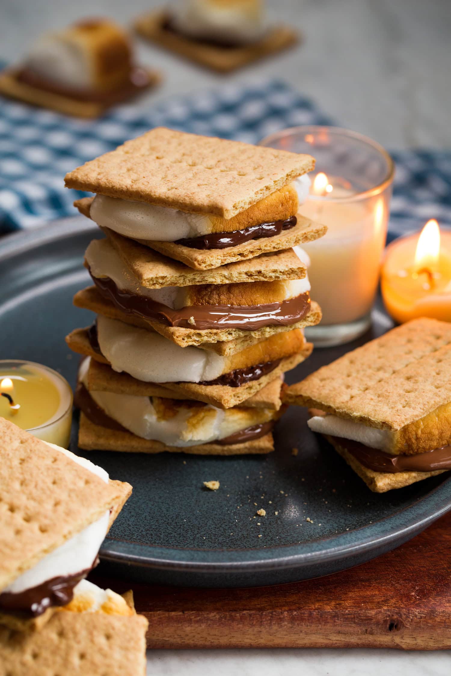 Oven S'mores Stacked s'mores with candles to the side.