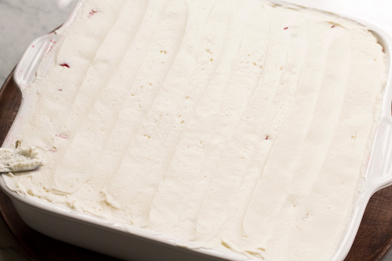 Strawberry Cheesecake Tiramisu Cream cheese mixture layered over tiramisu.