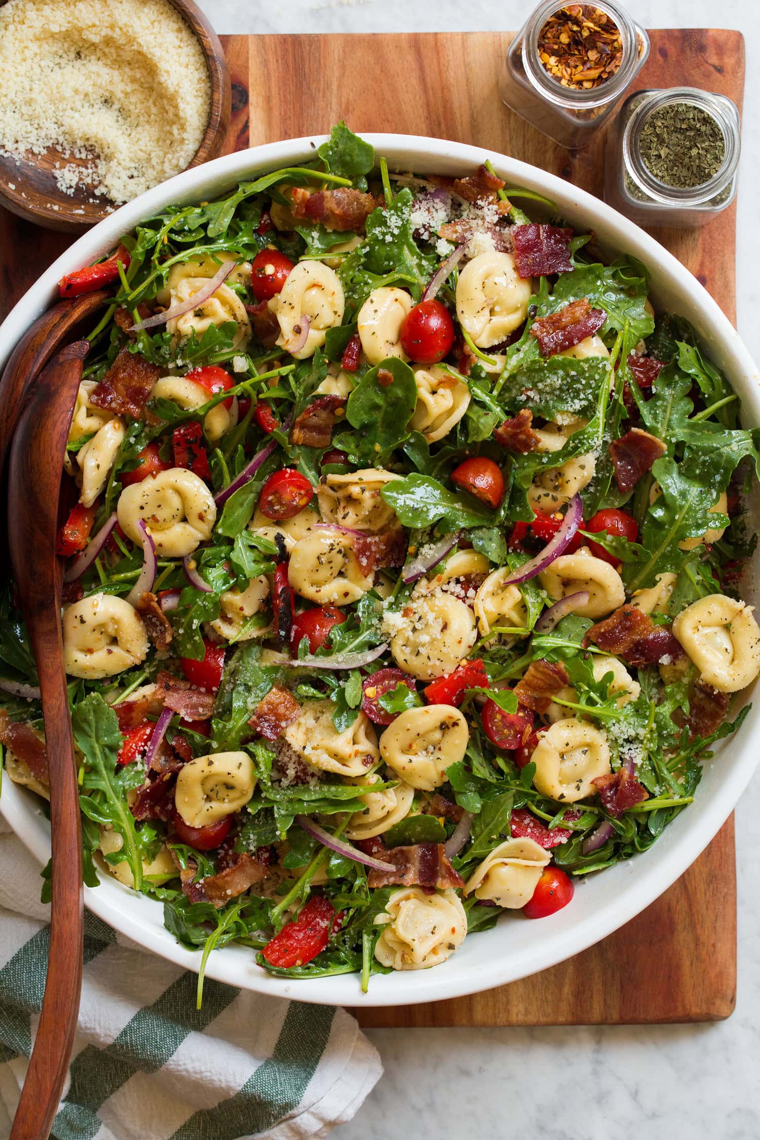 Tortellini Pasta Salad Tortellini, arugula, bacon, tomato, bell pepper salad.